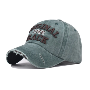 Close-up of vintage washed denim baseball cap with 3D embroidery and distressed brim details