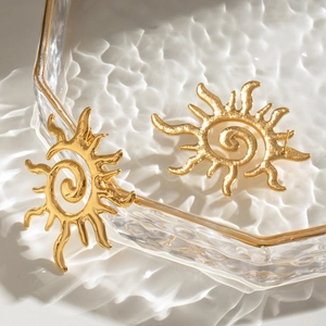 Golden sun-shaped rotating screw earrings for women in a minimalist radiant design