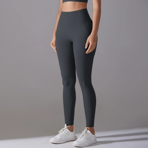 Macro detail of high-waist seamless charcoal grey yoga pants with high-elastic fabric