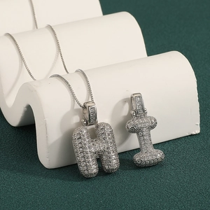 Bubble letter H and I pendants in silver finish with micro-pave cubic zirconia stones