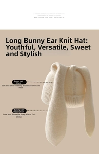 Detailed view of cream rabbit-ear knit hat showing soft wool blend fabric texture