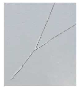 Detailed view of silver V-shape necklace with sleek vertical bar pendant on gray background