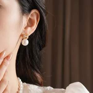 Elegant gold plated pearl letter earrings with shimmering rhinestones for women