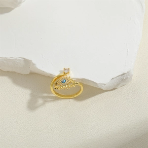 Retro evil eye adjustable open ring in gold finish with blue stones and zircons