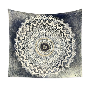 Bohemian mandala tapestry with intricate geometric floral pattern on dark blue background