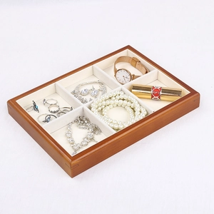 Solid wood jewelry tray with six compartments and soft cream velvet lining for display