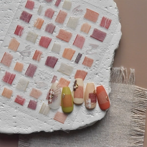 Detail of retro Japanese nail stickers with lattice patterns on warm matte nails
