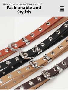 Close-up of stylish skinny belts with silver flower eyelets in four classic colors