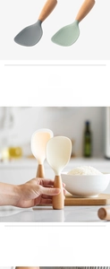 Macro shot of non-stick silicone rice paddle with heat-resistant wooden handle