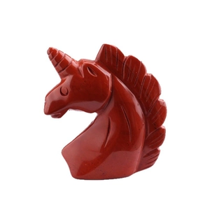 Hand-carved red jasper crystal unicorn head sculpture on a clean white background