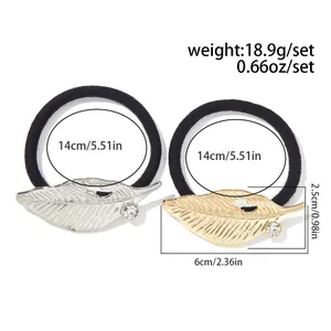 Detail view showing hair accessory dimensions of 14cm diameter and 6cm leaf ornament size