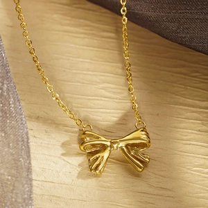 Elegant gold bow pendant necklace for women with minimalist stainless steel chain