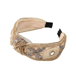 Lace embroidery headband with gold sequins and colorful floral patterns on white background