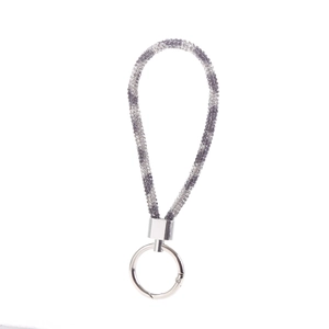 Detail view of a black-silver gradient braided strap keychain with silver metallic finish