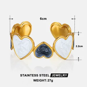 Macro detail of 18k gold plated stainless steel heart cuff with dimensions 6cm by 2.2cm