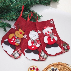 Three-piece linen Christmas stockings with reindeer, polar bear, and snowman appliques