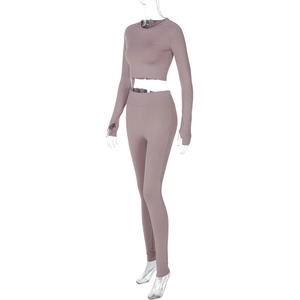 Side view of grey purple high-waisted yoga leggings and long sleeve cropped top set