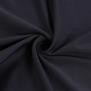 Macro shot of dark high-quality fabric texture and draped material of the mini skirt set