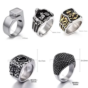 Detailed view of assorted titanium steel rings with anchor, eagle, and punk motifs