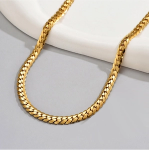 Men's gold stainless steel flat curb chain necklace displayed on a white jewelry stand
