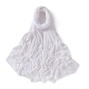 Close-up of pure white jersey cotton hijab showing soft texture and natural drape