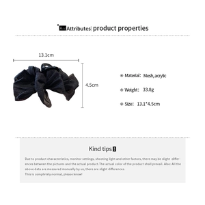 Detailed view of large black mesh bow hair claw clip with size 13.1cm and acrylic specs