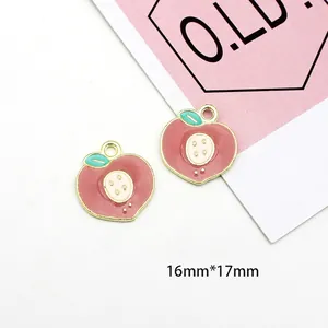 Detail showing two peach-shaped enamel charms with green leaves and 16mm x 17mm dimensions