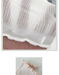 Detailed macro view of breathable cream lace mesh socks with scalloped edges and fine texture