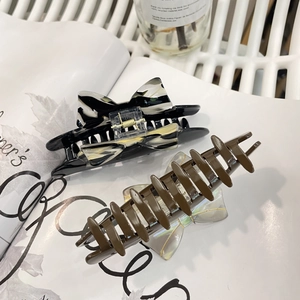 Vintage French acetate hair claw clips with bow design and abstract patterns for women