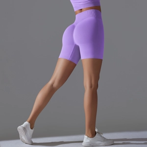 Seamless high waisted purple yoga shorts with a scrunch butt lifting design for fitness