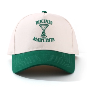 Detail of vintage baseball cap with green letter embroidery and martini glass patterns