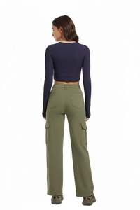 Back view of high-waist olive green cargo pants paired with navy ribbed crop top