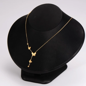 Elegant gold butterfly necklace with delicate beads on a minimalist fine metal chain