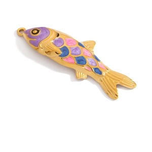 Macro view of gold-plated fish pendant featuring colorful enamel scales and hanging loop