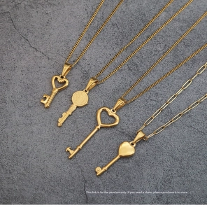 Detail of four vintage gold heart key pendants crafted in durable stainless steel