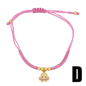 Bohemian style pink braided rope bracelet featuring a gold octopus pendant with zircon stones