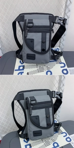 Vue détaillée du sac de jambe tactique gris avec poches zippées et boucles en nylon