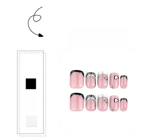 Close-up of pink and black French press-on nails with starburst and heart patterns