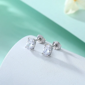 Macro detail of oval cut zircon stud earrings in S925 sterling silver with polished finish