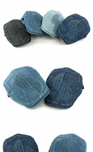 Detail of washed denim beret featuring mesh patchwork and contrast stitching texture