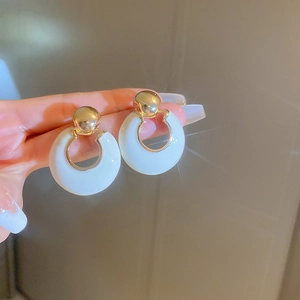 French luxury white circular hoop earrings with golden metal clasps for women