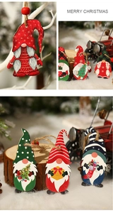 Detailed view of festive painted wooden gnome ornaments with hanging jute ropes and beads