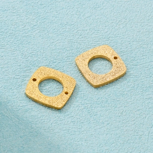 Pair of square gold frosted pendants with hollow circular cutouts for DIY jewelry design