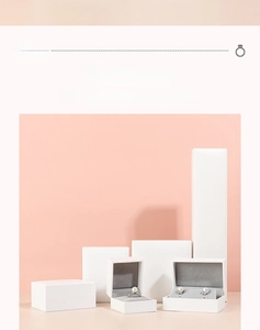 Various sizes of white lychee textured jewelry boxes with grey velvet lining inserts