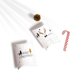 White Christmas pillow gift boxes featuring golden reindeer and Merry Christmas tree prints