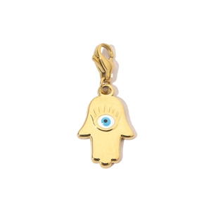 Detail of a golden Hamsa hand pendant with a blue evil eye and lobster clasp closure