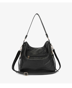 Close-up of black PU leather tote bag featuring elegant golden hardware and smooth zipper