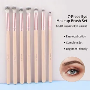 Kit de 7 pinceaux yeux beige avec viroles or rose et poils dégradés noir et blanc élégants