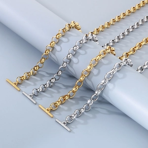 Close-up of titanium steel round link chains with OT toggle clasps in gold and silver