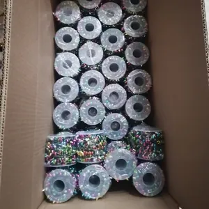 Colorful Christmas bead garland rolls stored in a bulk shipping carton box